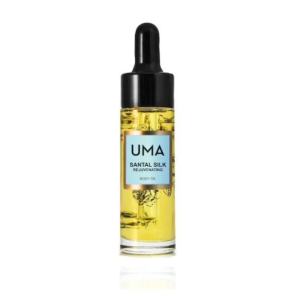 Kleine UMA Santal Silk Body Oil Flasche mit Pipette steht vor weißem Hintergrund.