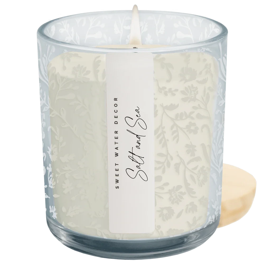 Blaue Duftkerze mit floralem Laserdesign im Glas