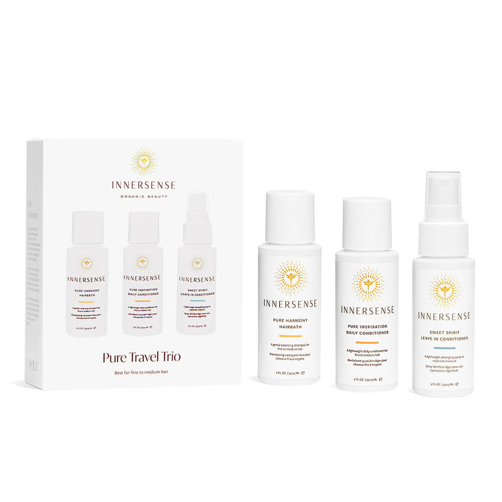 Innersense Pure Travel Trio Verpackung sowie die drei dazugehörigen Produkte stehen nebeneinander vor weißem Hintergrund.