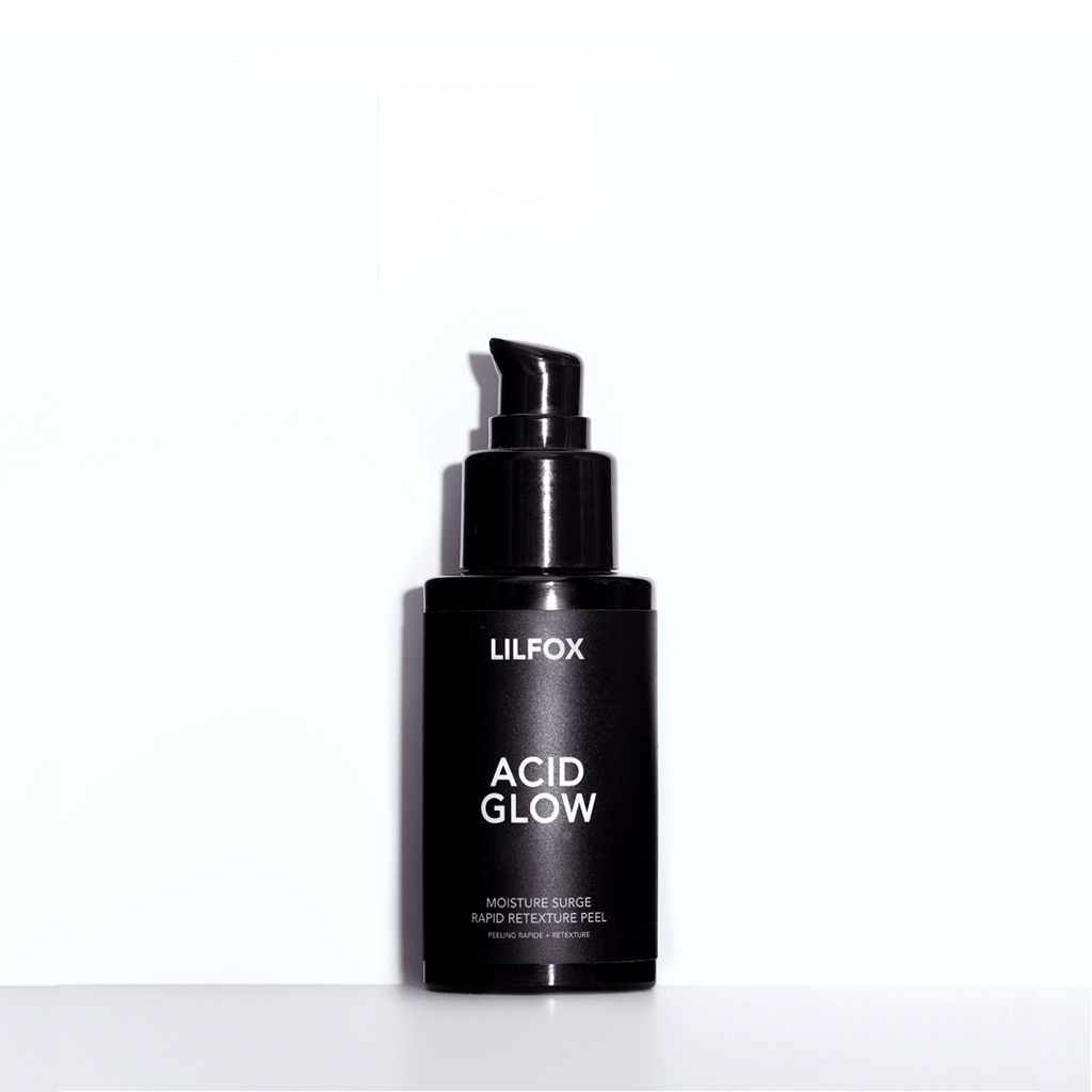 Acid Glow schwarze Flasche vor weißem Hintergrund