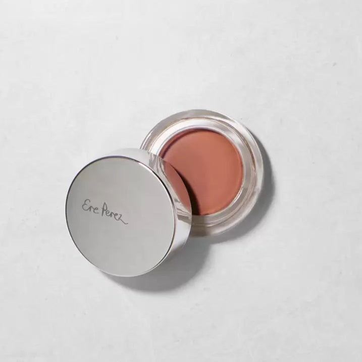 Ere Perez Carrot Colour Pots offener Tiegel mit angelehntem Deckel auf weißem Untergrund.