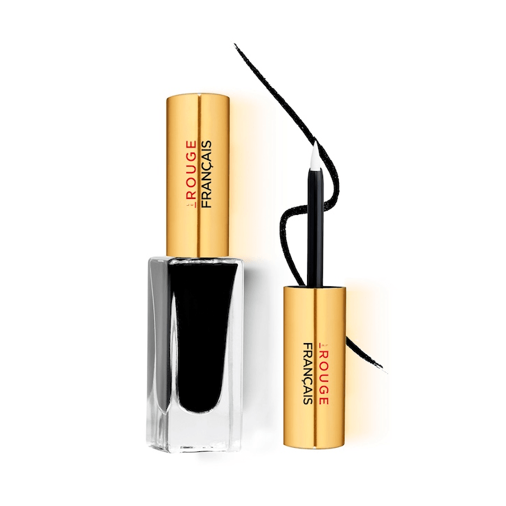 Le Noir CÉPHÉE No 510 Eyeliner Glasflasche mit goldenem Deckel steht neben dem Pinsel vor weißem Hintergrund.