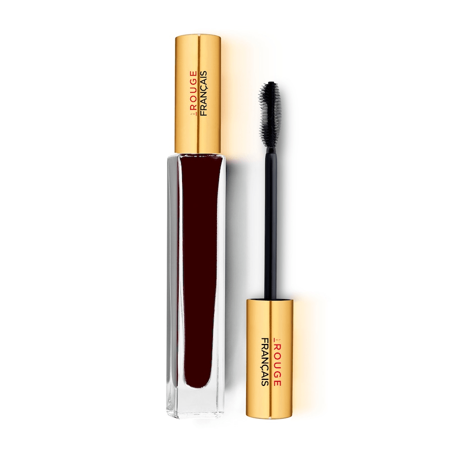 Mascara Glasflasche Le Purpre Andromède No 420 steht neben einer Silikonwimpernbürste vor weißem Hintergrund.