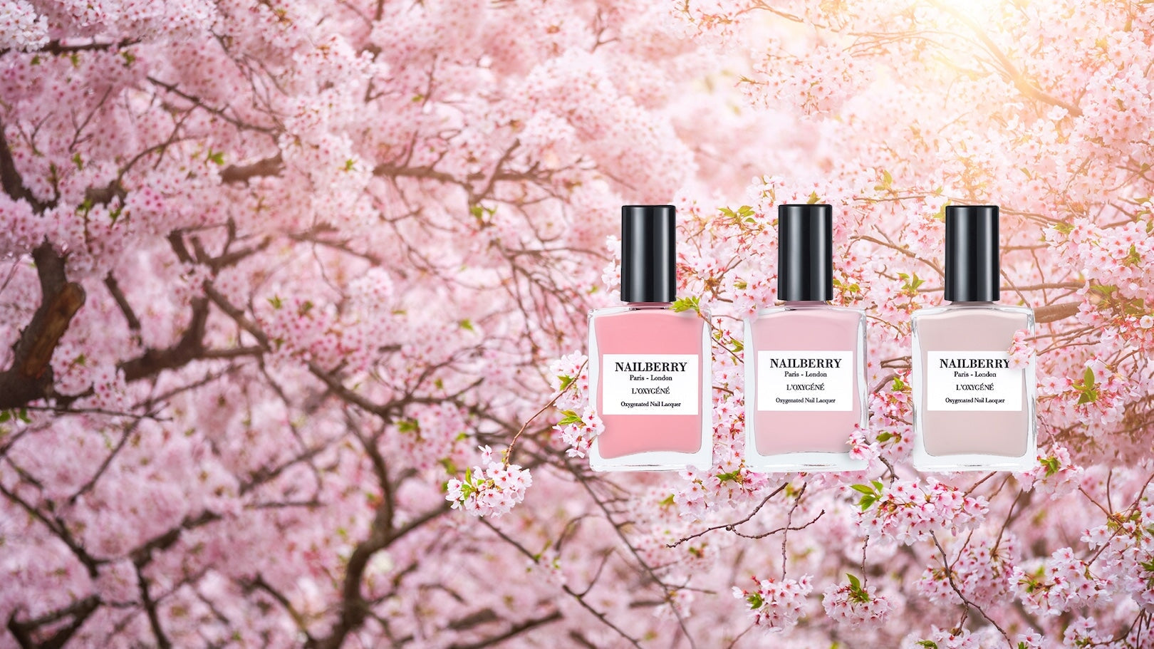 2 Nailberry Nagellackflaschen liegen geöffnet aufeinander, Lack tropft heraus.