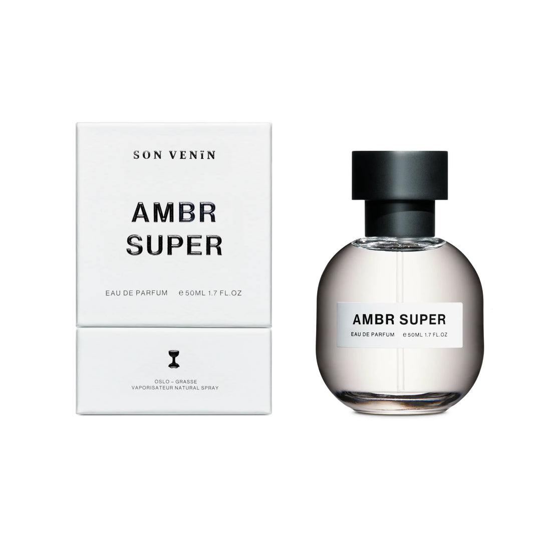 AMBR SUPER von SON VENIN, Verpackung. und Parfum nebeneinander. North Glow