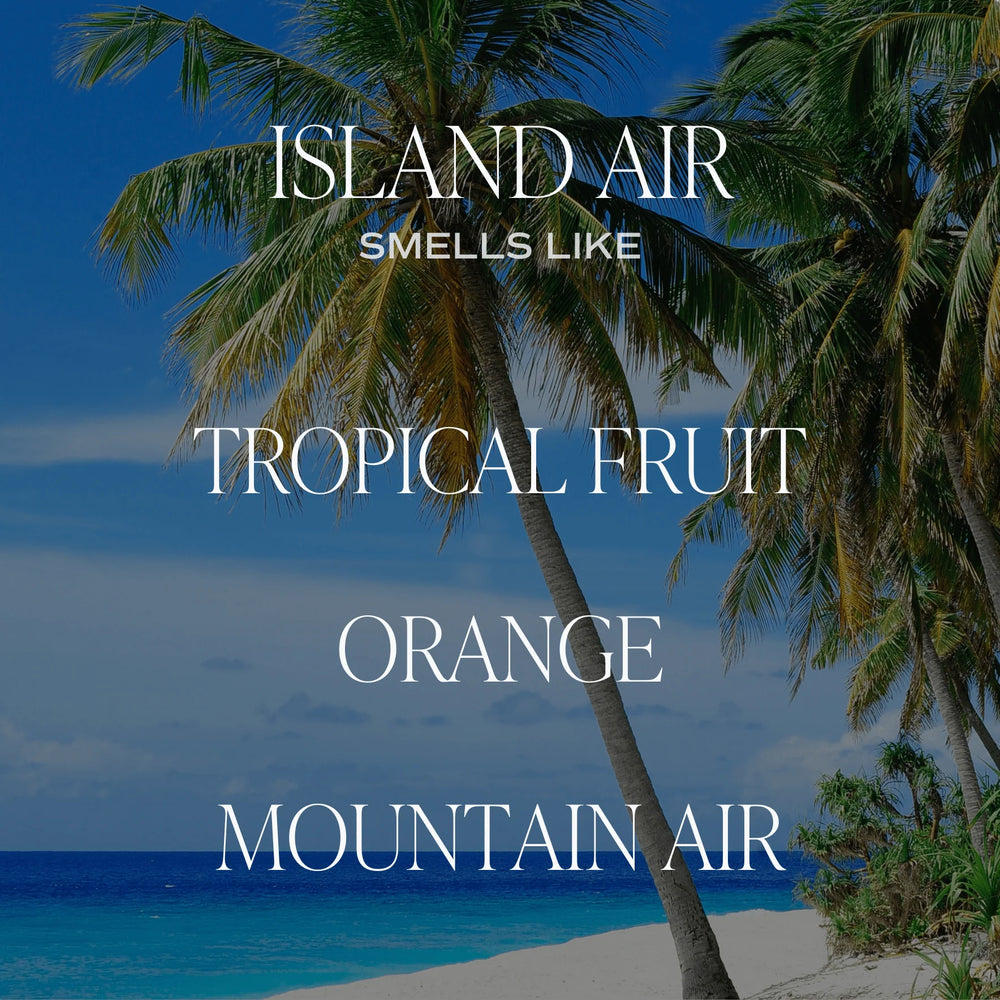 Im Hintergrund Palem und Meer, im Vordergrund die Worte "ISLAND AIR smells like TROPICAL FRUIT, ORANGE, MOUNTAIN AIR".