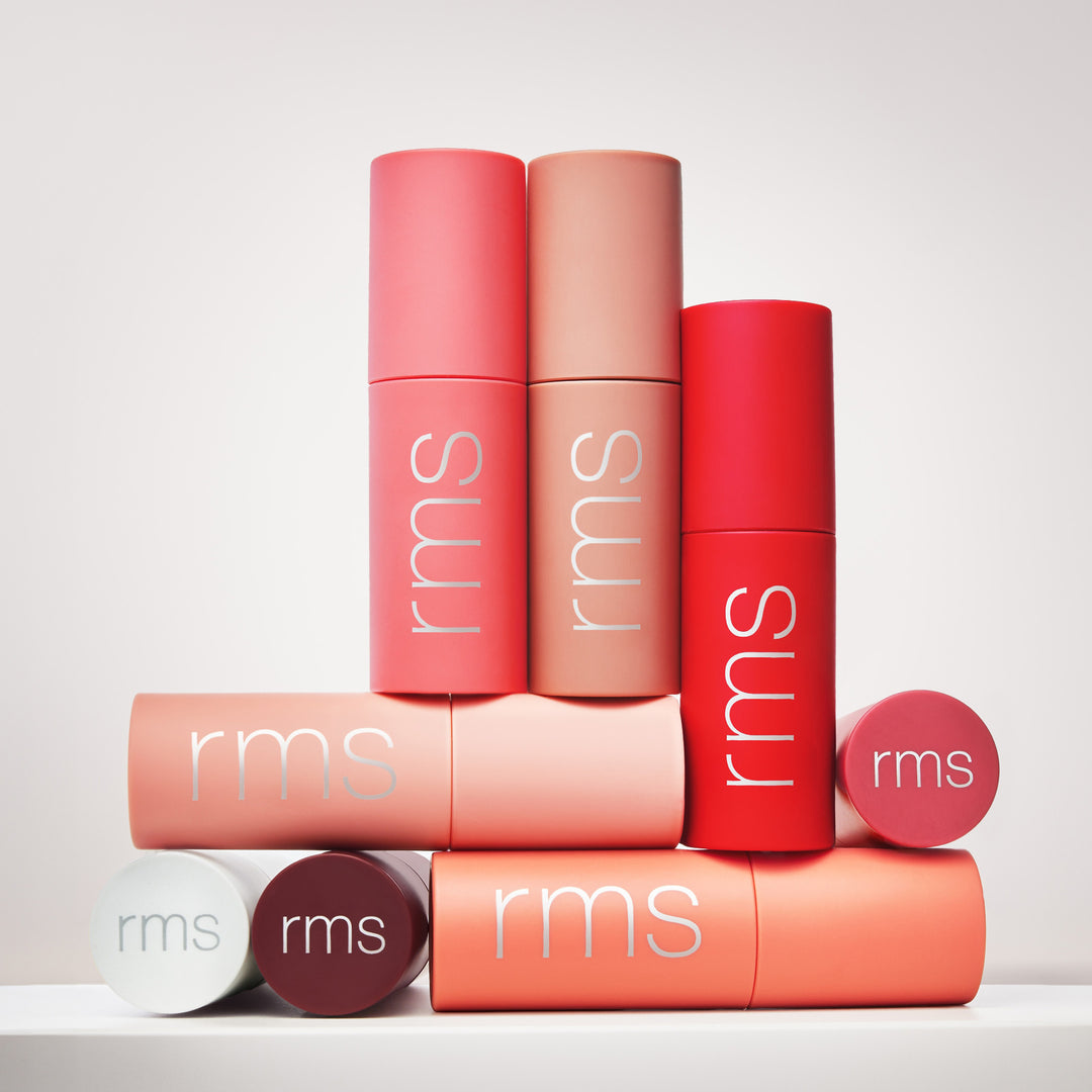 Die 8 Farben des Legendary Lip Oil von RMS Beauty nebeneinander, stehend und liegend. North Glow