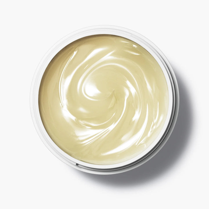Offener Tiegel der Manasi 7 Botanical Cleanser Caulis aus der Vogelperspektive steht auf weißem Untergrund.