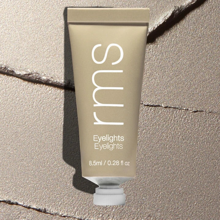 Tube Eyelights Cream Eyeshadow Eclipse vor Farb- und Texturbeispiel.