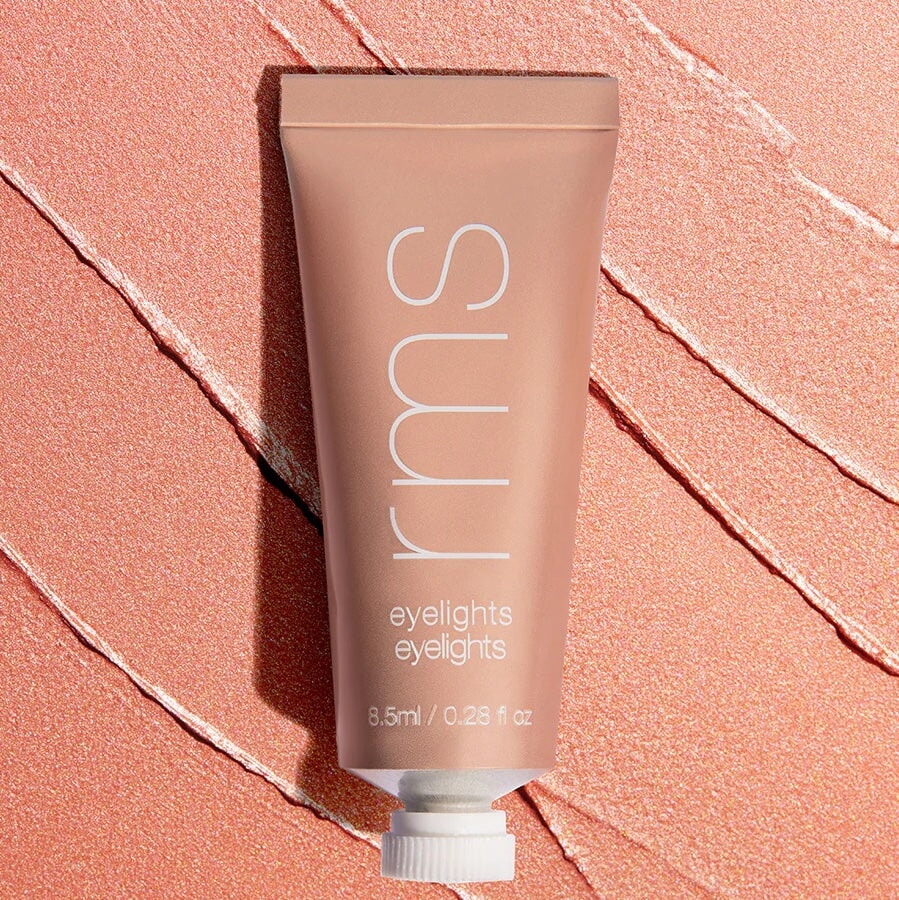 Tube Eyelights Cream Eyeshadow Sunbeam vor Farb- und Texturbeispiel.