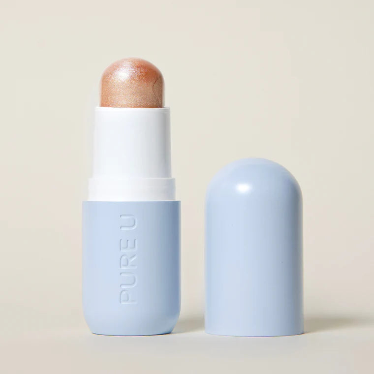 Highlighter Balm von PURE U. Cosmetics geöffnet vor beigem Hintergrund.