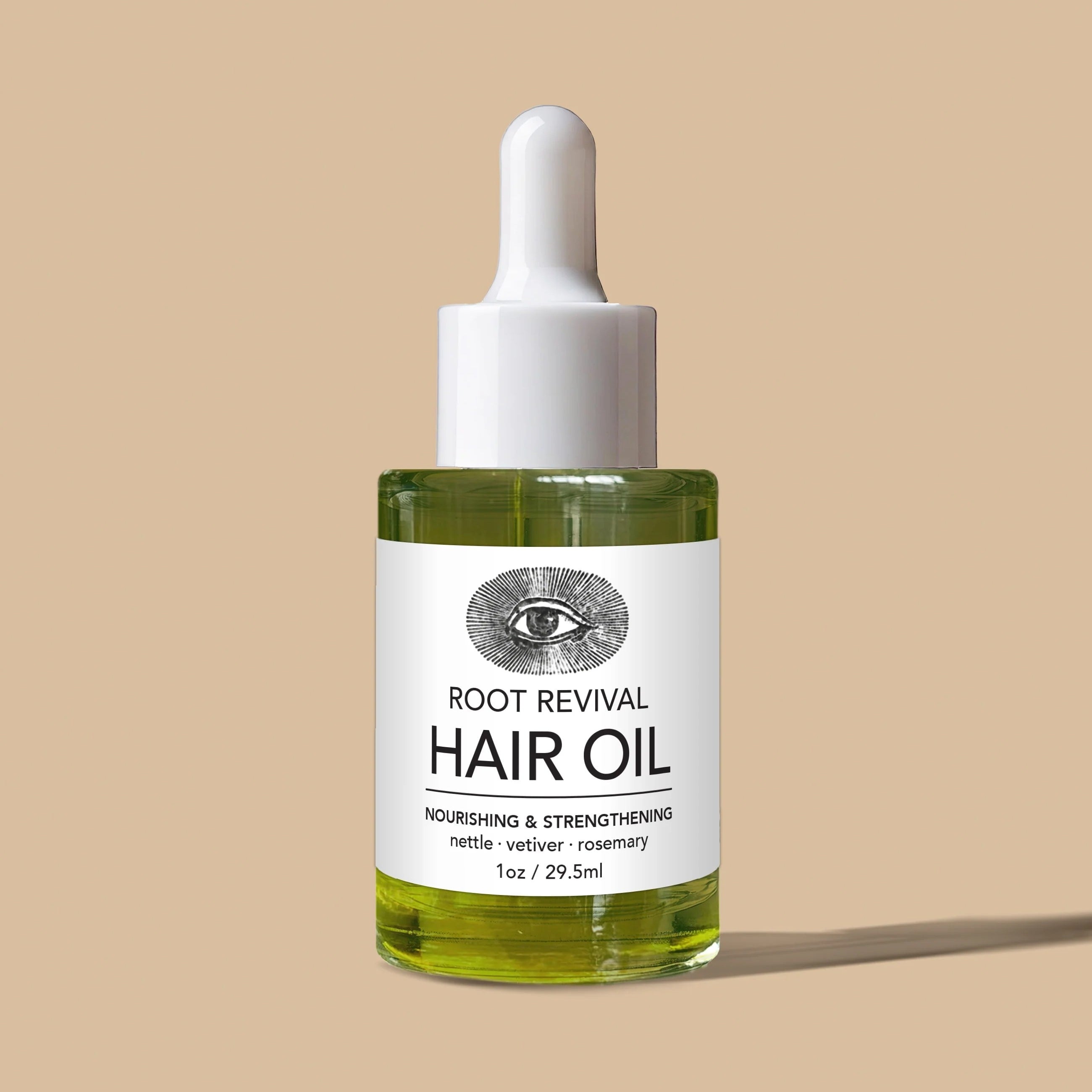 Pipettenflasche Anima Mundi Hair Oil steht vor hellem Hintergrund.