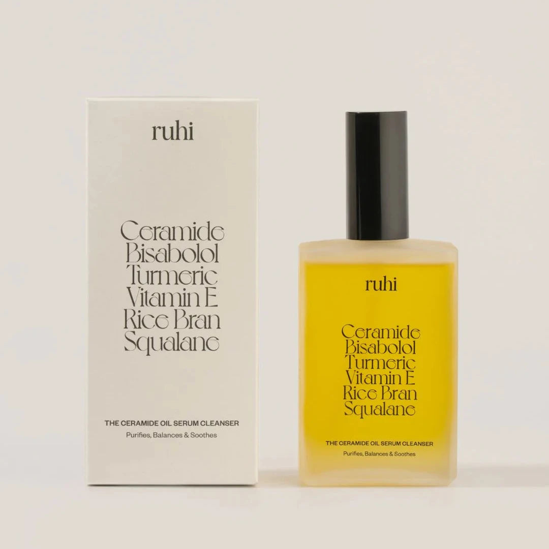 ruhi - The Ceramide Oil Serum Cleanser Flakon neben Produktverpackung vor hellem Hintergrund.