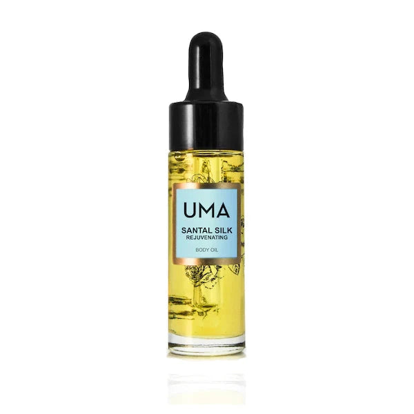 Kleine UMA Santal Silk Body Oil Flasche mit Pipette steht vor weißem Hintergrund. North Glow