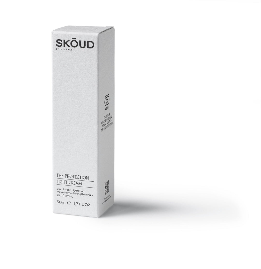 SKŌUD The Protection Light Cream weiße Verpackung steht vor weißem Hintergrund. North Glow