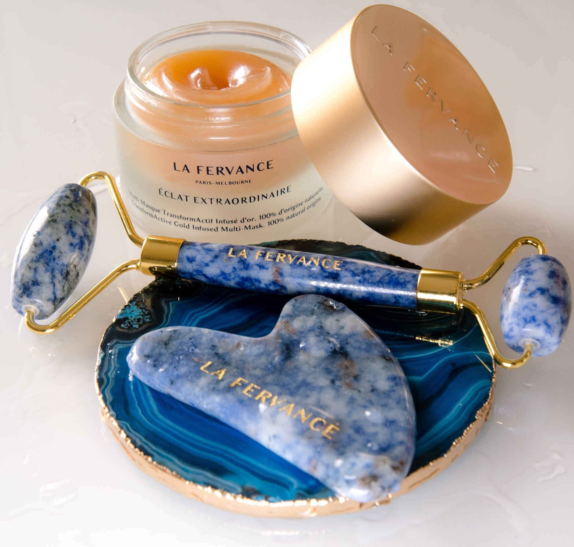 Gua Sha and facial roller made of blue sodalite as a combined anti-aging kit