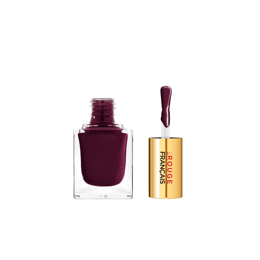 Offene Glasflasche mit auf dem Kopf stehenden Pinsel des Le Vernis No 917 Rouge Porphyra Nagellacks.
