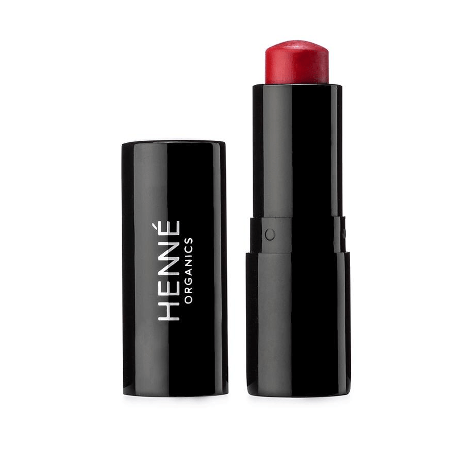 Schwarzer Lippenstift der Farbe Desire von Henné Organic steht offen vor weißem Hintgergrund.