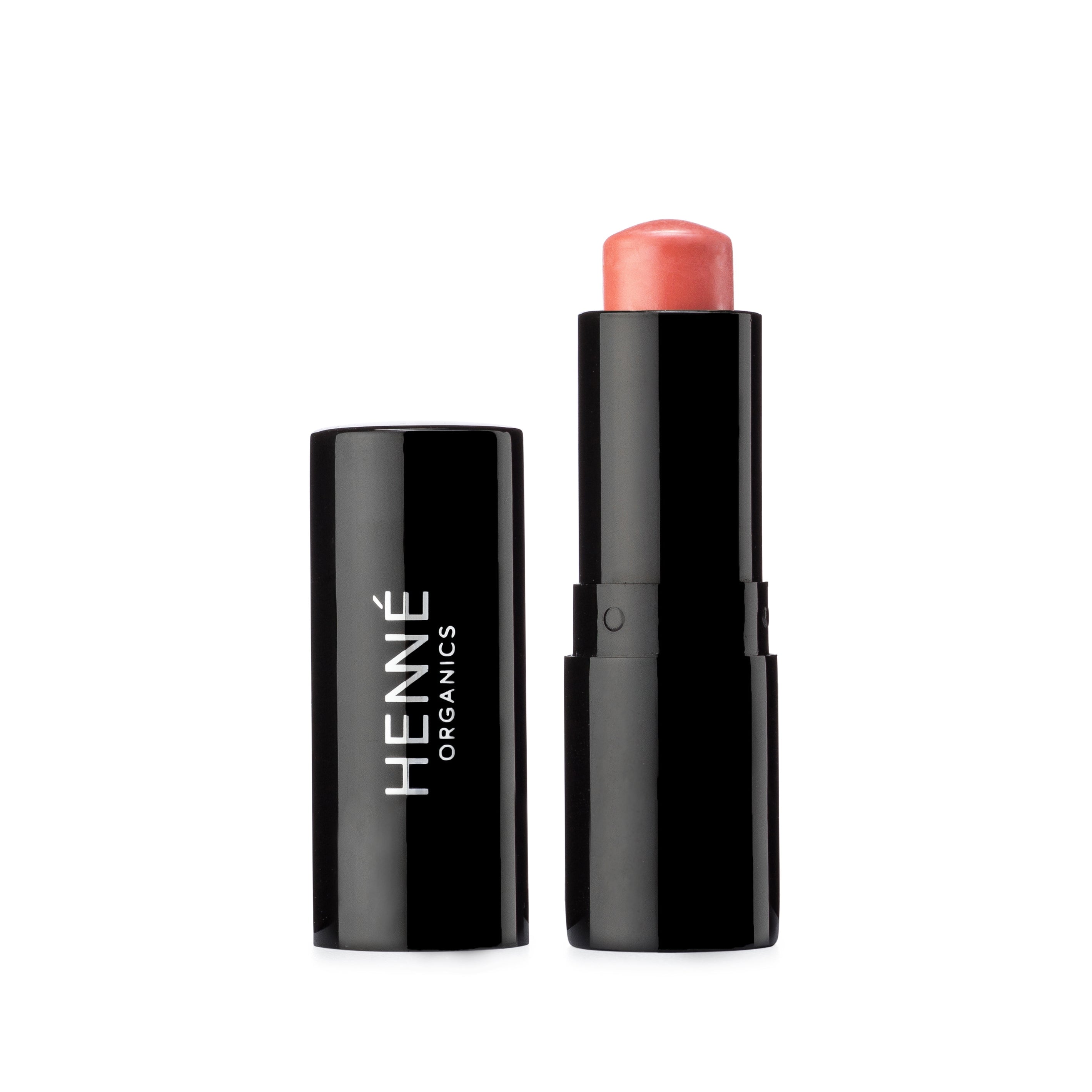 Offener Lippenstift der Farbe Sunlit von Henné Organics vor weißem Hintergrund.
