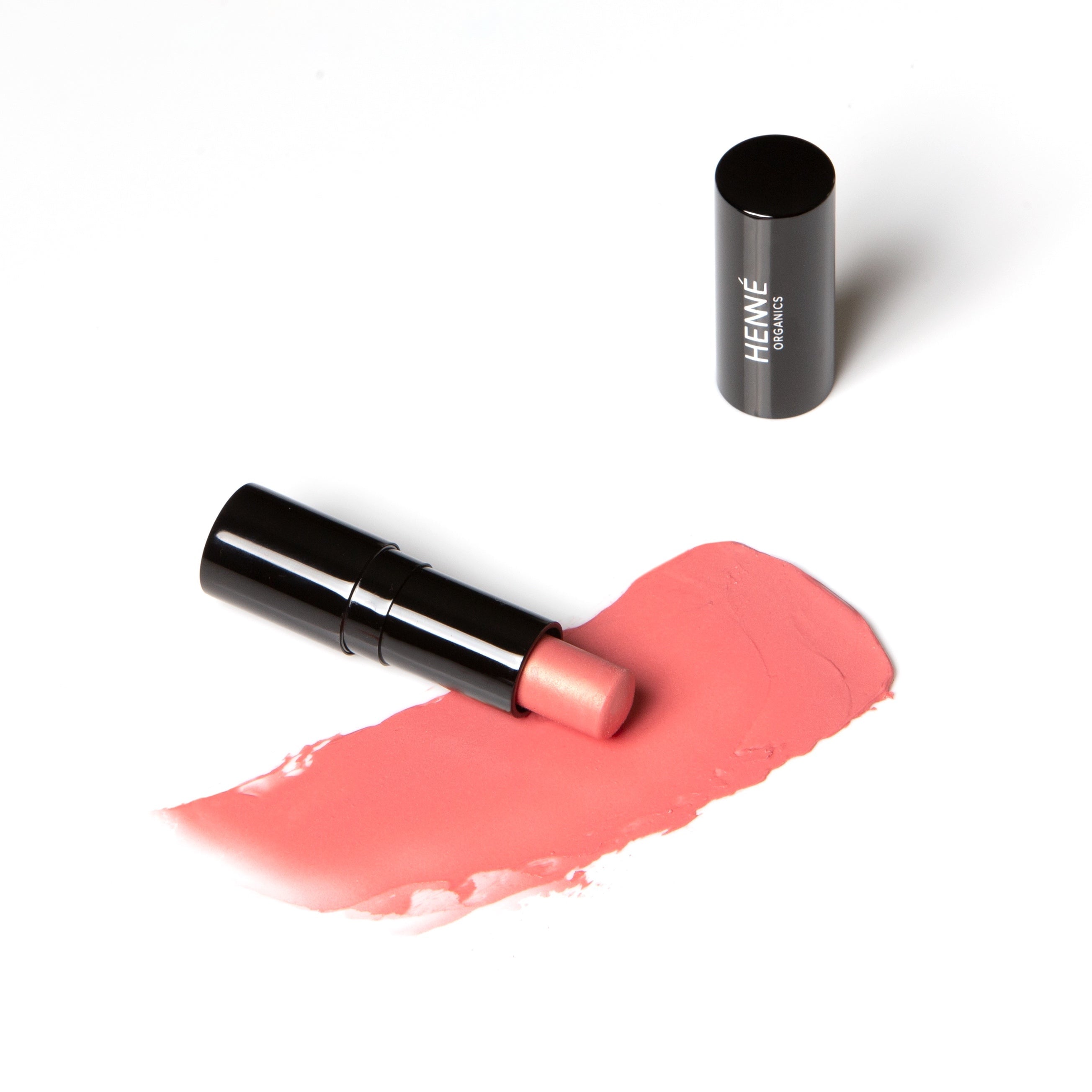 Schwarzer Lippenstift mit Farb- und Texturbeispiel der Farbe Sunlit von Henné Organics.