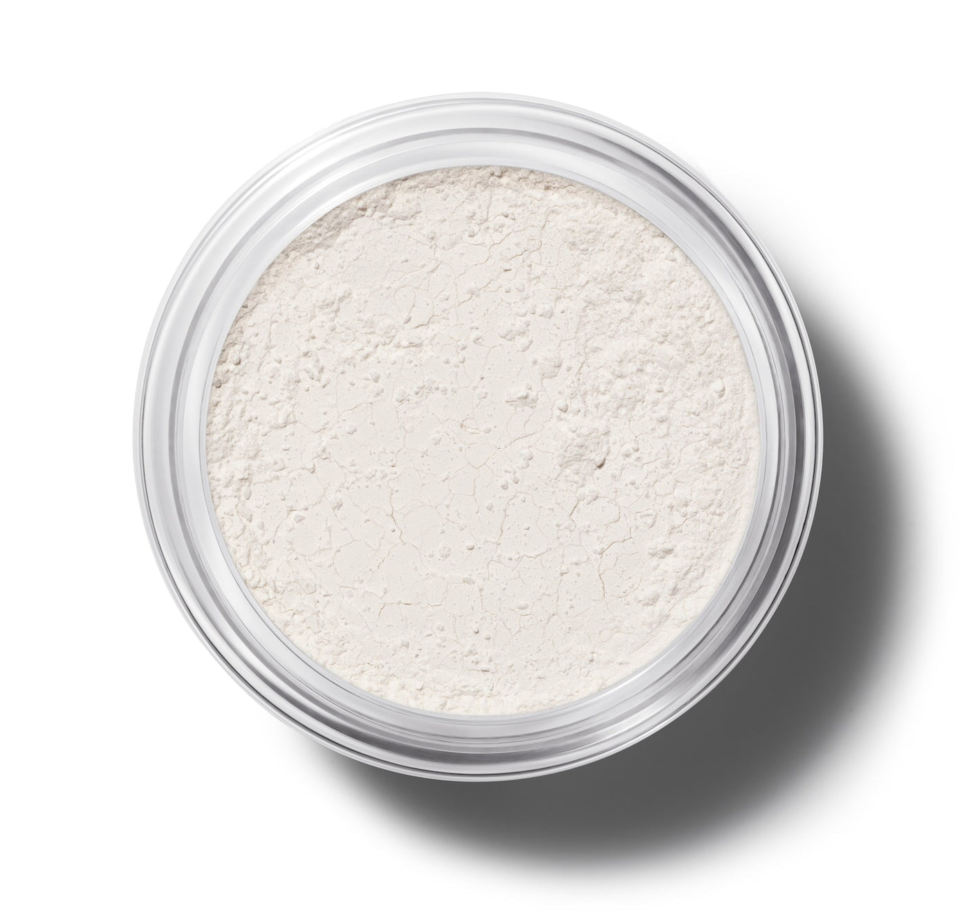 Offener Tiegel Manasi 7 Silk Finish Powder Translucent aus der Vogelperspektive vor weißem Hintergrund.