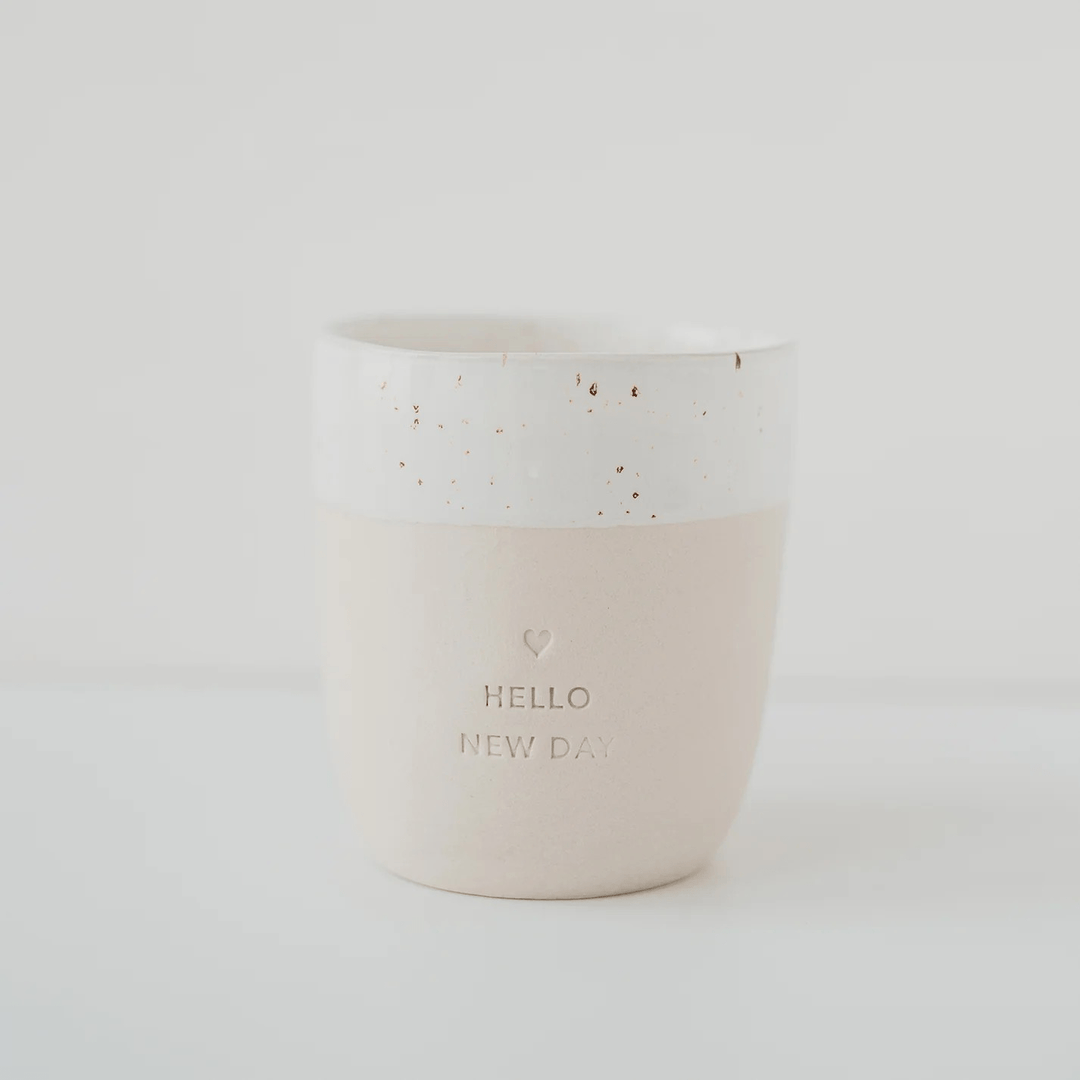 HELLO NEW DAY" mug against a white North Glow background
