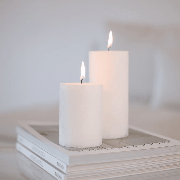 2 different sized block candles Olive from Eulenschnitt in white are on product catalogs.