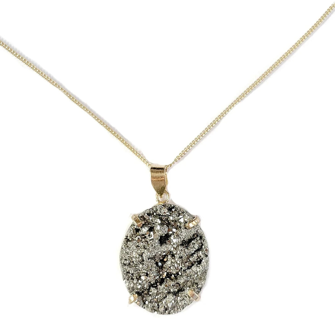 Gold-plated necklace with a set pyrite gemstone against a white background.