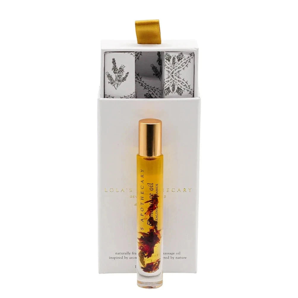 Lola's Apothecary Delicate Romance Deluxe Roll-On in front of white gift box 