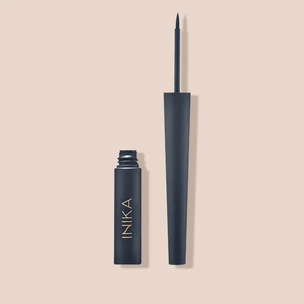 INIKA Liquid Eyeliner open against a beige background.