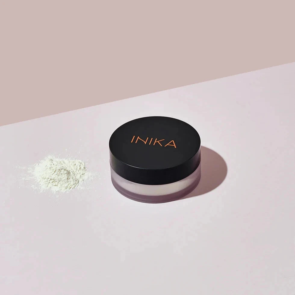 INIKA jar, next to Mineral Setting Powder.