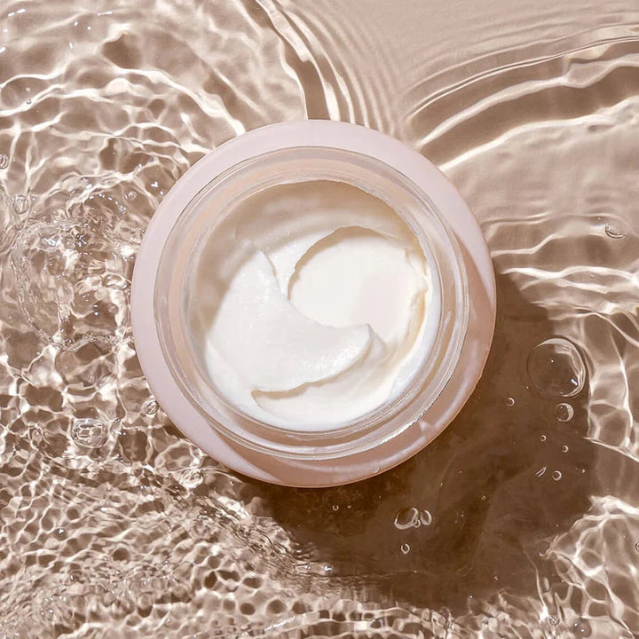 INIKA Phytofuse Renew day Cream opened with water in motion