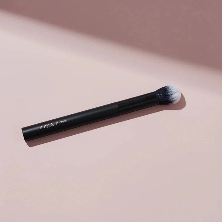 INIKA Organic Setting Brush lying flat.