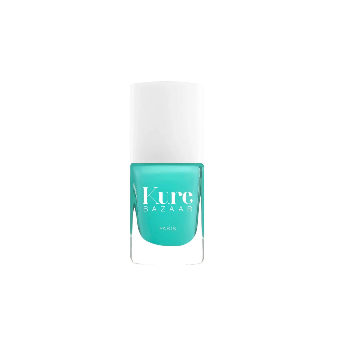 Nail polish "Caicos" by Kure Bazaar against a white background. North Glow