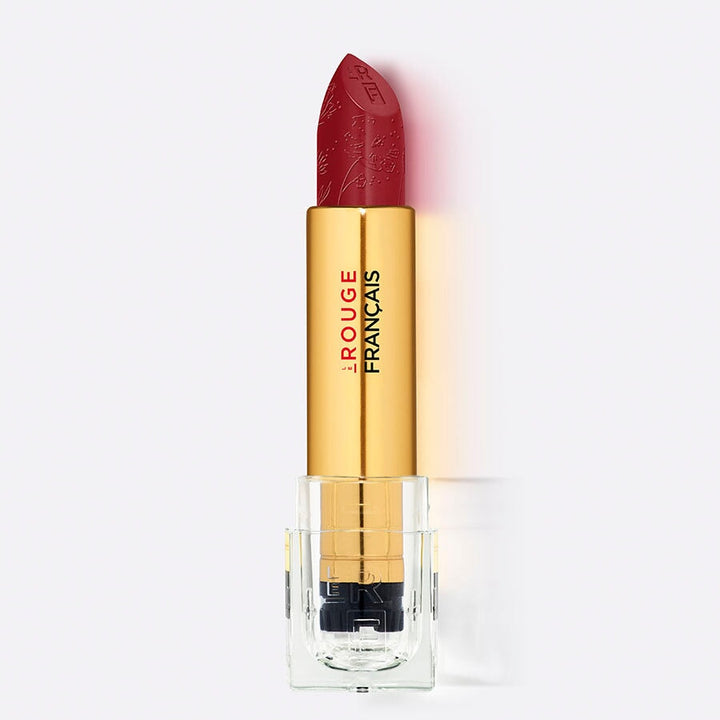 Offener Lippenstift Le Rouge Tinctorial No 010 Francais vor weißem Hintergrund.