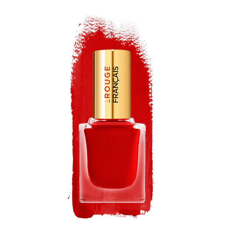 Glass bottle of Le Vernis No 980 Rouge Catenella nail polish in front of a color sample on a white background.
