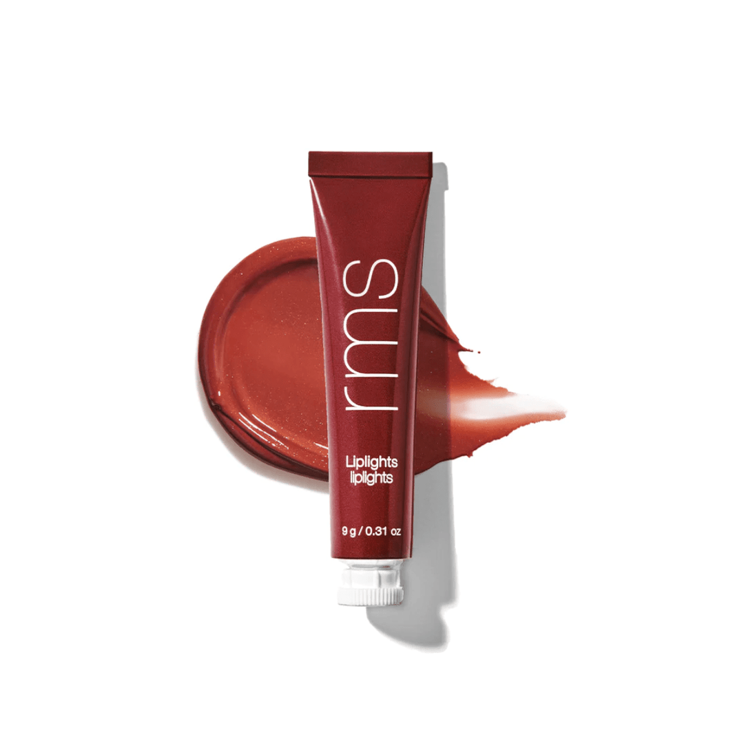 RMS Liplights Rhapsody Tube in front of a color and texture sample against a white background.