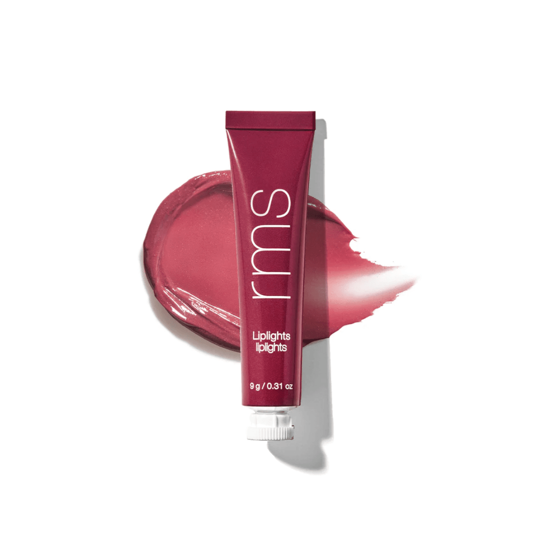 RMS Liplights Rhythm Tube in front of a color and texture sample against a white background.