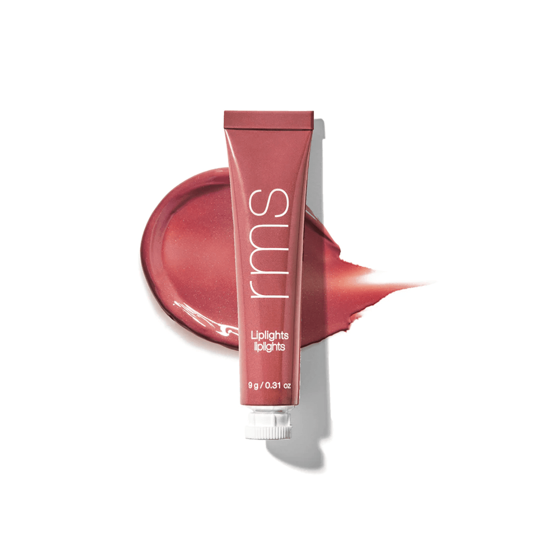 RMS Liplights Rumor Tube in front of a color and texture sample against a white background.