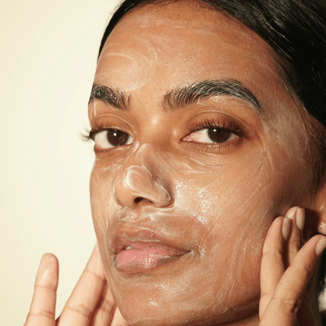 Female model uses Ranavat Luminous Ceremony Cleanser on face