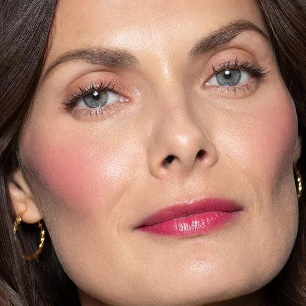 ILIA Multi-Stick A Fine Romance applied on the face of the model