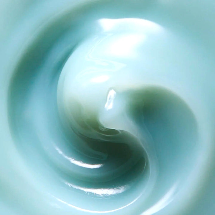 Texture example Ranavt Lotus Cleansing Balm, light blue-green gel in close-up.