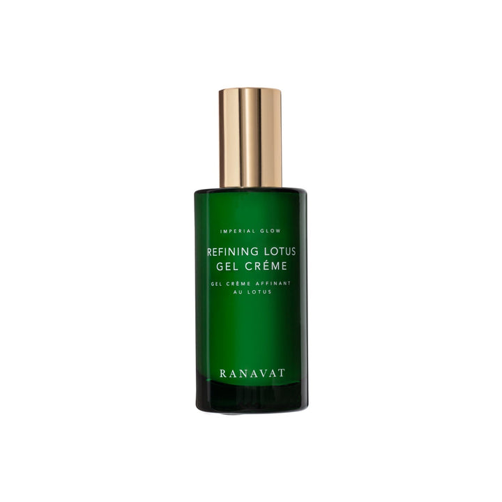 Green glass bottle with golden lid Ranavat Refining Lotus Gel Crème stands against a white background.