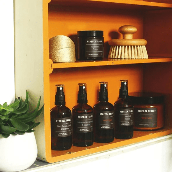 Open shelf with various products and room fragrances