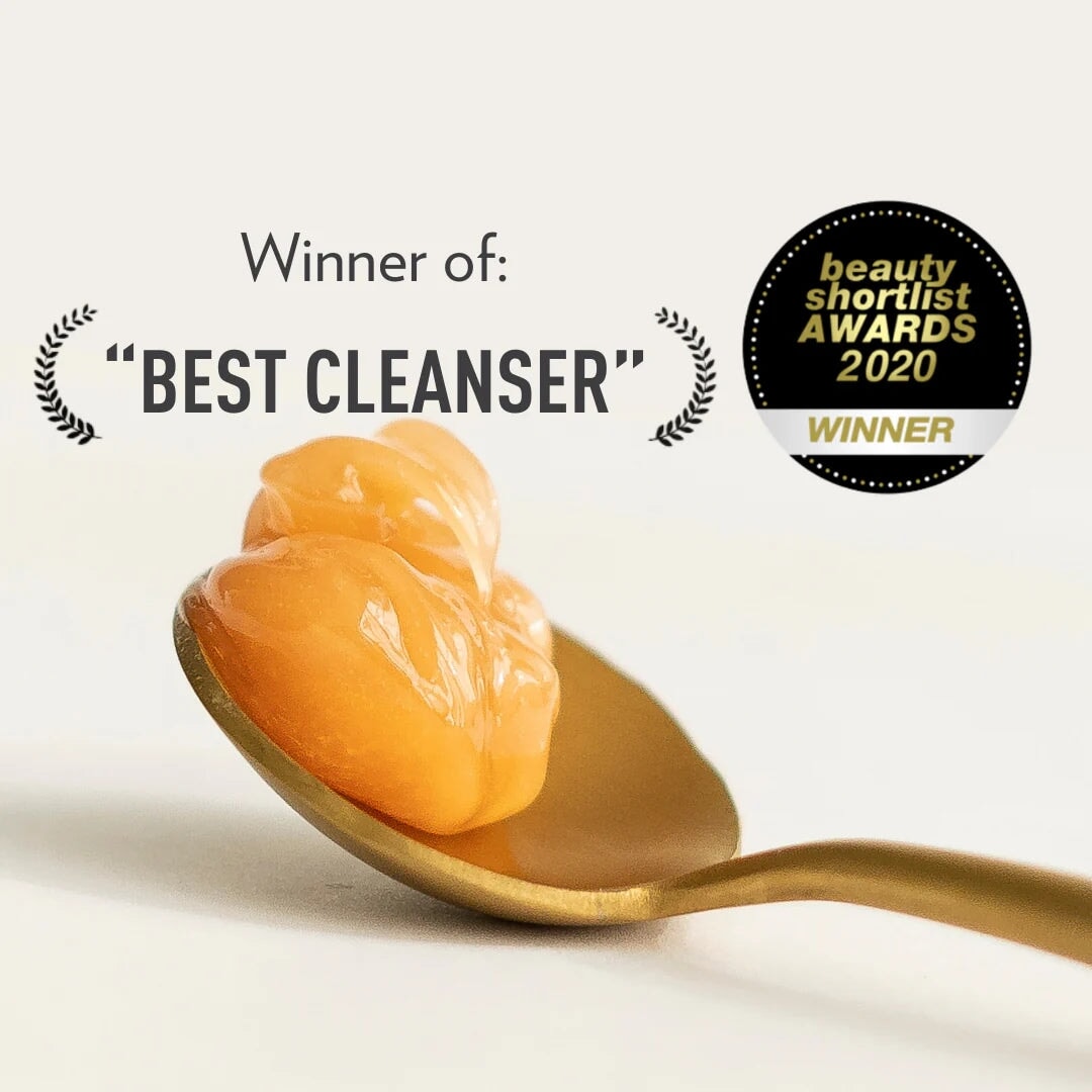 Dafna's Recovery Cleanser product on a brass spoon under the lettering beauty shortlist AWARDS 2020 North Glow