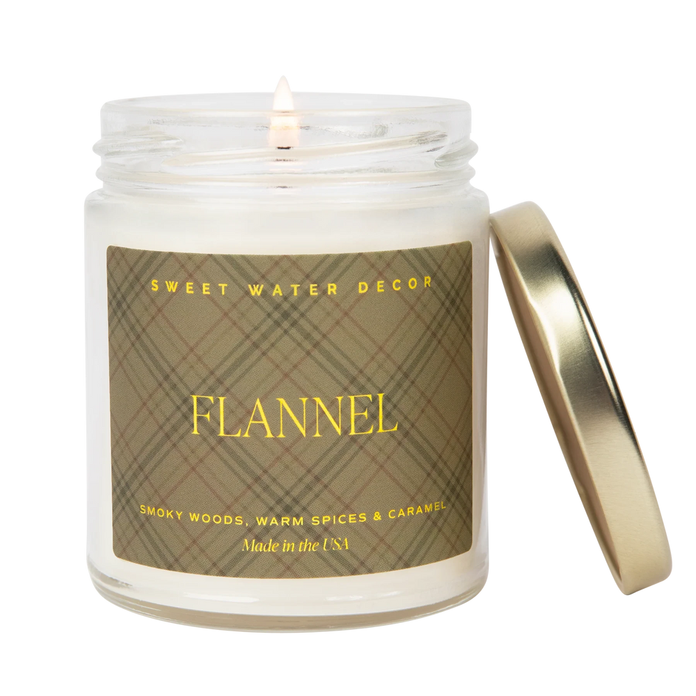 Sweet Water Decor soy wax candle with inscription "Flannel" against white background