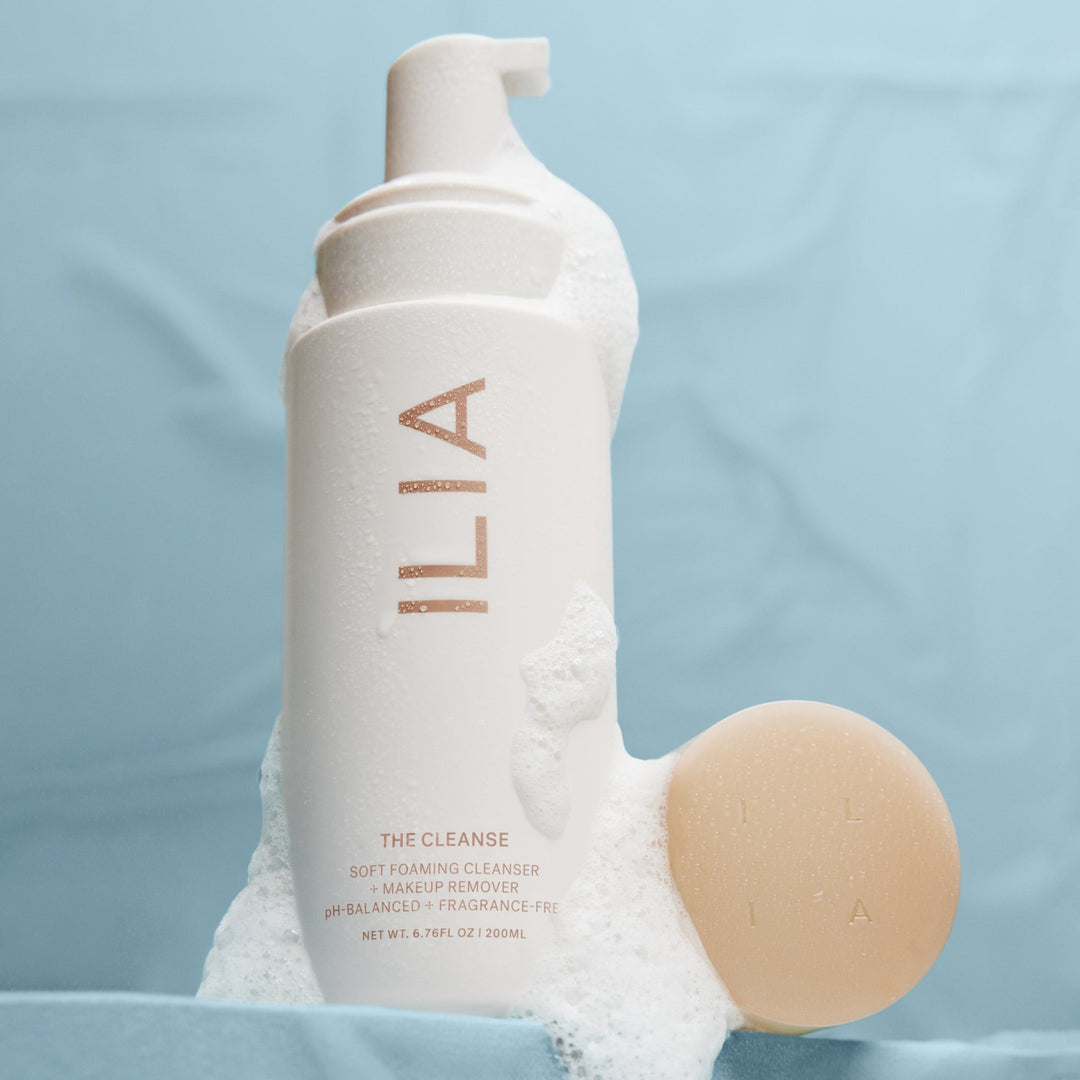 Foam flows down from an ILIA The Cleanse pump bottle.