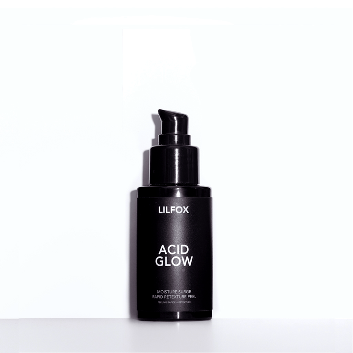 Acid Glow black bottle against white background