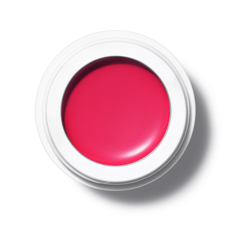 A bird's eye view of the open All Over Color Fuchsine jar on a white background.