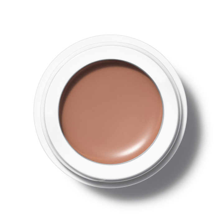 A bird's eye view of the open All Over Color Manketti jar on a white background.